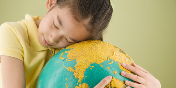 Girl hugging the globe